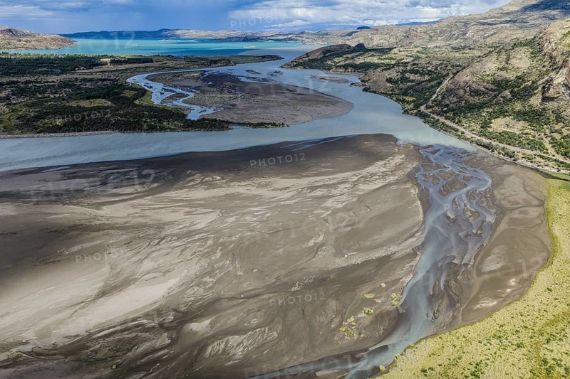 Sandbank in the river Rio Ibanez short before flowing into lake Lago General Carrera, steep road leading to Puerto Rey, aerial view, Patagonia, Chile