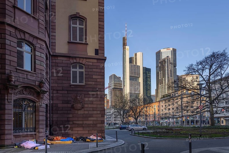 Several homeless people sleep in the morning near St. Paul's Church at the foot of Frankfurt's banking skyline. An unresolved problem is the steadily increasing number of people living in Frankfurt am Main in the open air, Frankfurt am Main, Hesse, Germany