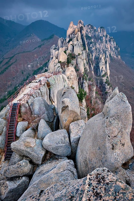 View of stones and rock formations from Ulsanbawi rock peak in stormy weather with clouds. Seoraksan National Park, South Corea