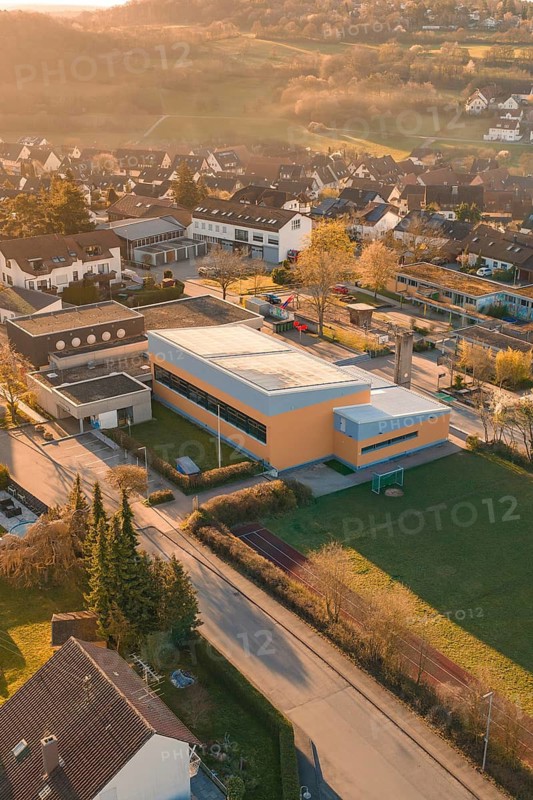 School complex next to residential buildings in an autumn landscape, Schlehengäuschule, Gechingen, Hecken and Gäu region, Calw district, Germany