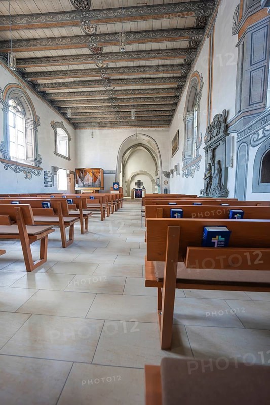 Long central aisle in a church flanked by wooden benches, Deufringen, Aidlingen, Böblingen district, Germany