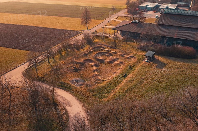Ground area with curvy contours near a building, surrounded by quiet rural landscape, bike park, Gechingen, Calw district, Germany