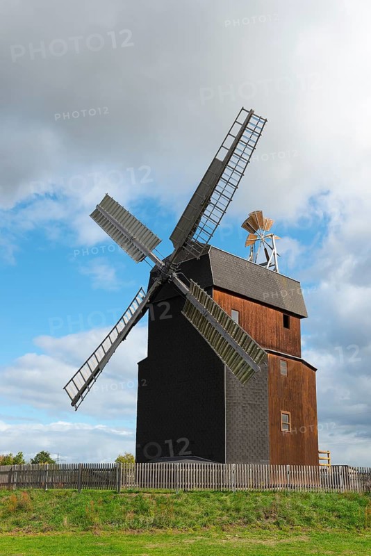 Wooden windmill with blue sky and clouds in the landscape, Paltrock windmill, Parey, Elbe-Parey, Jerichower Land, Saxony-Anhalt, Germany