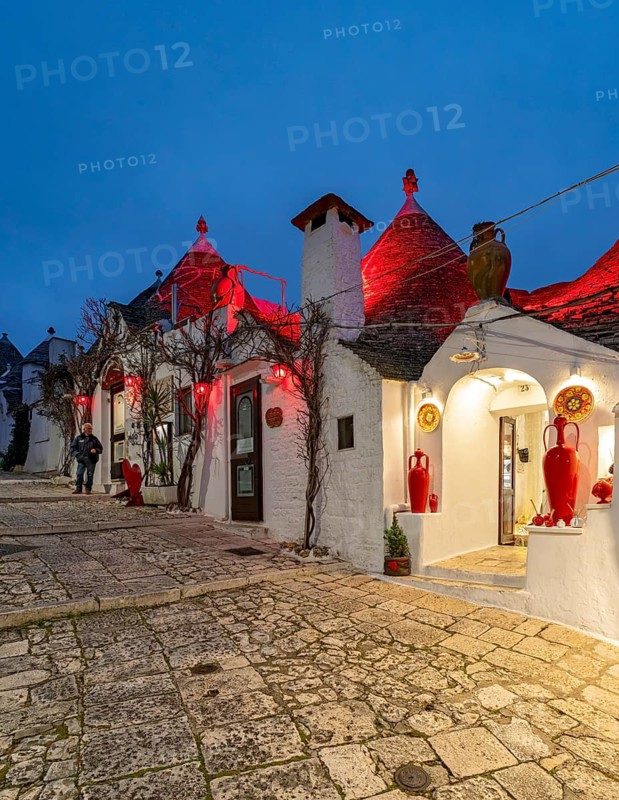 Street with Trulli houses by night, Rione Monti, Alberobello, Apulia - Puglia, Italy