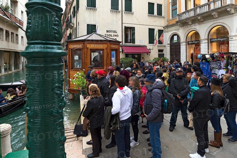Tourists waiting for gondola rides, Venice, Veneto, Italy
