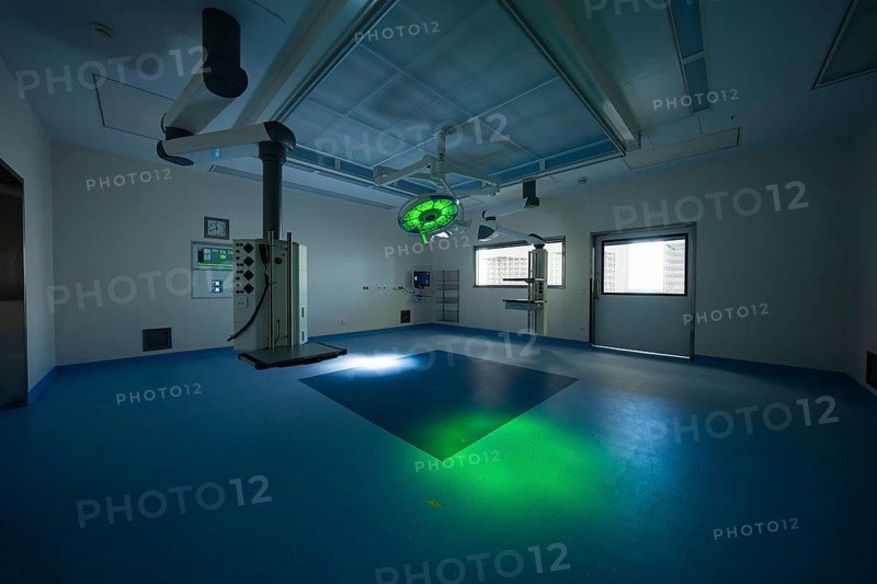 Operating room with green lighting, dark ambiance and modern equipment, operating room in the new Calw hospital, Calw district, Germany