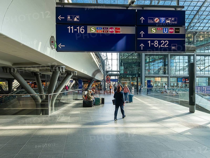 Everyday scenes, travelers and railway employees as well as the interior design, signs, signposts and the DB travel center, in and at Berlin Central Station, Germany