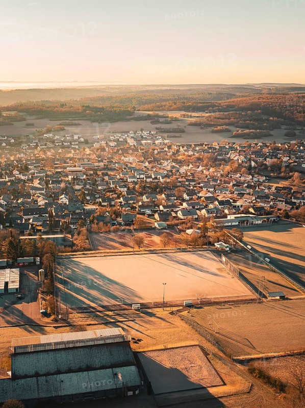 Overview of a town with houses and fields in the early morning light, Gechingen, Heckengäu region, Calw district, Germany