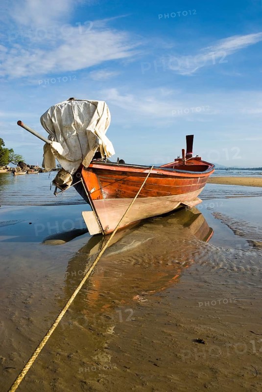 Longtail boat on the shores of Nai Yang Beach in the north of the Thai holiday island Phuket, Thailand, Asia, Southeast Asia, holiday island, boat, boats, longtail boats, reflection, mirrored, water reflection, stranded, dried