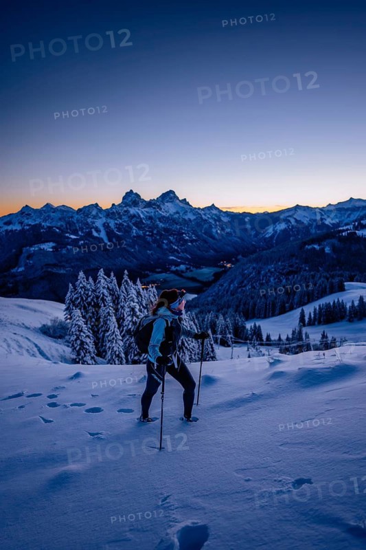 Hiking in the snow in the snow-covered winder landscape in the Alps at Neunerköpfle in the Tannheimer Tal in Tyrol, Austria