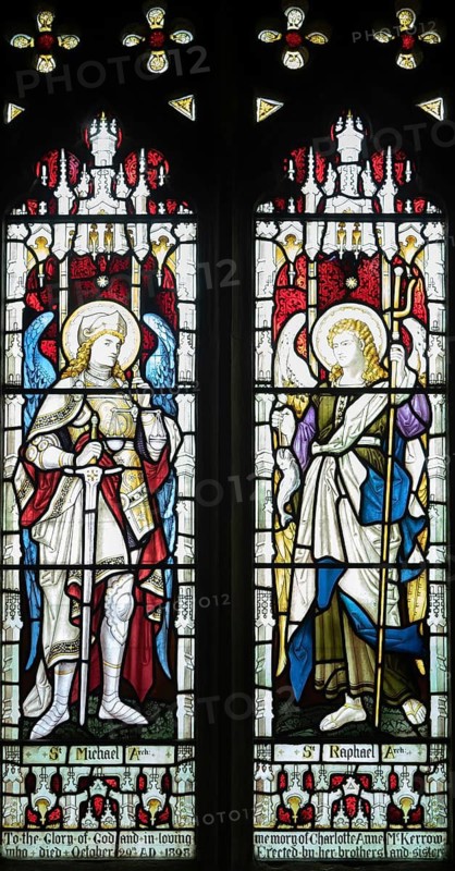 Stained glass window of Saint Michael and Saint Raphael archangels, Ansford church, Somerset, England, UK