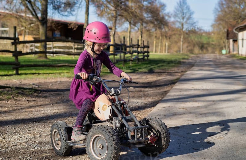 Girl, 4 years, blonde, crash helmet, riding quad, children's quad bike, Sonnenhof, Erlebnisbauernhof, Stuttgart, Baden-Württemberg, Germany
