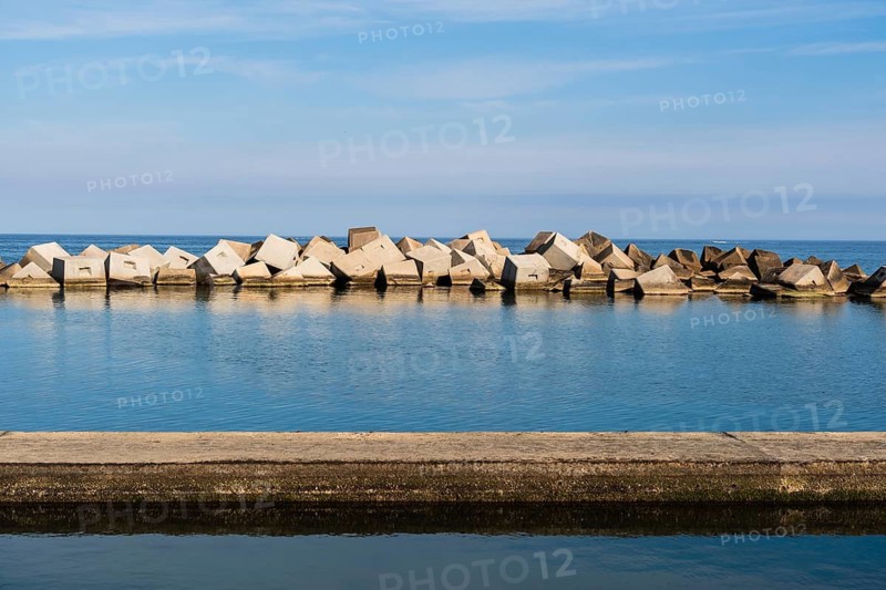 Cube-shaped blocks as breakwaters near the Forum in Barcelona, Spain