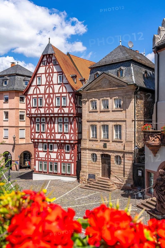 Reconstructed half-timbered building of the Löwenapotheke and historic sandstone Abbey Glöcknerhaus, Stiftsplatz, Aschaffenburg, Lower Franconia, Bavaria, Germany