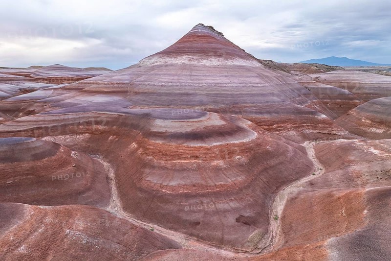 Scenic aerial drone view showcasing the mesmerizing geological formations near Hanksville, Utah, with sweeping curves and layered sedimentary rocks