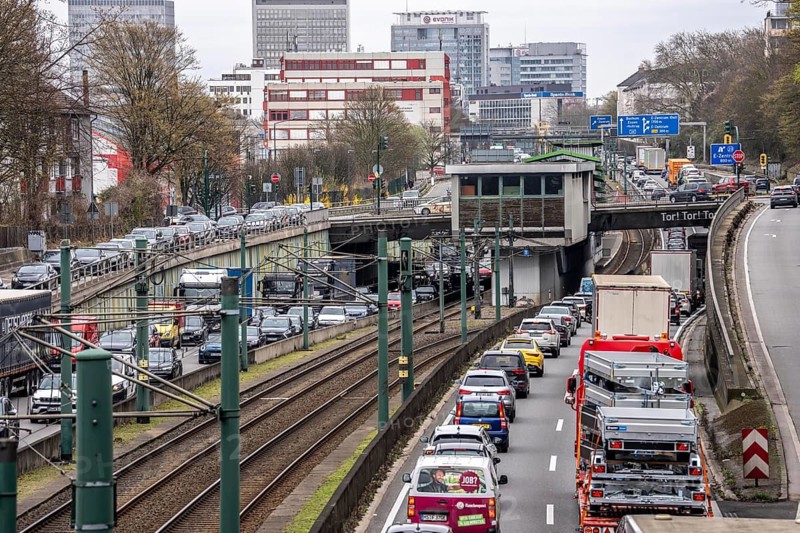 Everyday traffic jam on the A40 motorway, Ruhrschnellweg, in Essen, a good 5 km traffic jam heading east, Dortmund, near Essen city center, narrow lanes, two-lane, heavy traffic, commuters stuck in motorway traffic, North Rhine-Westphalia, Germany
