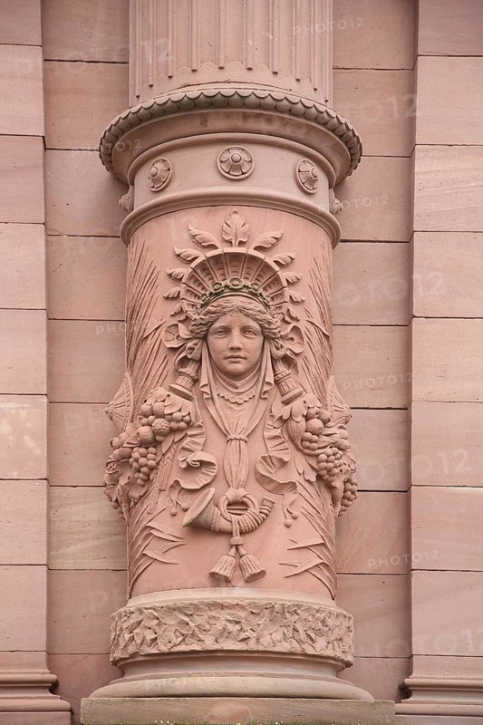Relief figure with post horn on column, Old Post Office built in 1893, detail, decorations, red, stone, monochrome, Pirmasens, Palatinate Forest, Rhineland-Palatinate, Germany