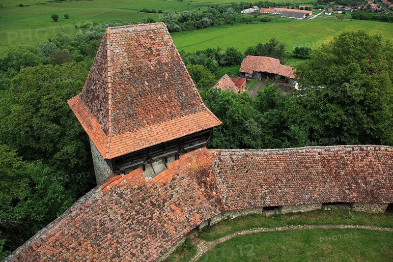 Romania, view from the church tower of the defensive wall and tower of the fortified church of Viscri, German Deutsch-Weisskirch a town in the district of Brasov, Transylvania, UNESCO World Heritage Site