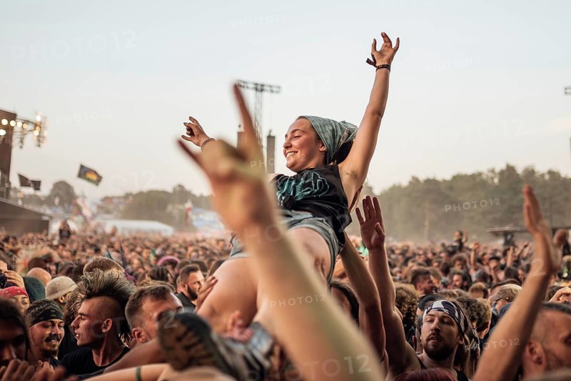 KOSTRZYN NAD ODRA, POLAND - AUGUST 2, 2018: The audence carry the young woman on their hands during rock concert at the Pol'andRock Festival