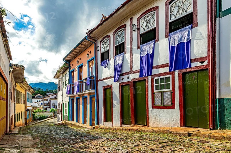 Houses with banners in the windows during Holy Week celebrations in Ouro Preto, Ouro Preto, Minas Gerais, Brazil