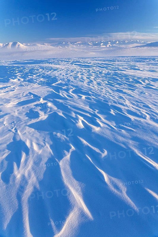 Mountain landscape in winter, snow drifts, evening light, Arctic, Brooks Range, North Slope, Alaska, USA