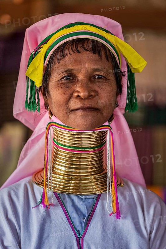 INLE LAKE, MYANMAR, JANUARY 7, 2014: Unidentified Padaung long-necked tribe woman. The Padaung long-necked tribe women wear brass rings around neck from 5 years old and minority of Myanmar exploited for tourism reasons