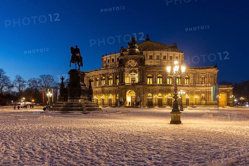 Illuminated Semper Opera House and Theatre Square with snow at dusk, Old Town of Dresden, Saxony, Germany