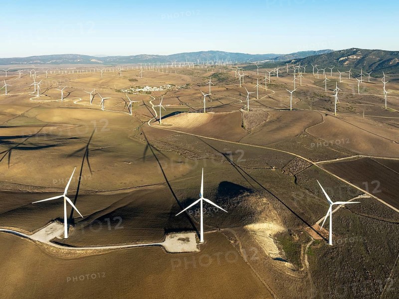 Windmills on a wind farm near Zahara de los Atunes. Aerial view. Drone shot. Cádiz province, Andalusia, Spain