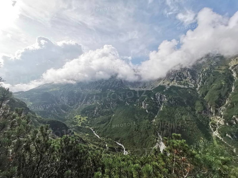 Impressive mountain range with dramatic cloud formations, Zakopane, hiking in the High Tatras National Park, Carpathian Mountains, Poland