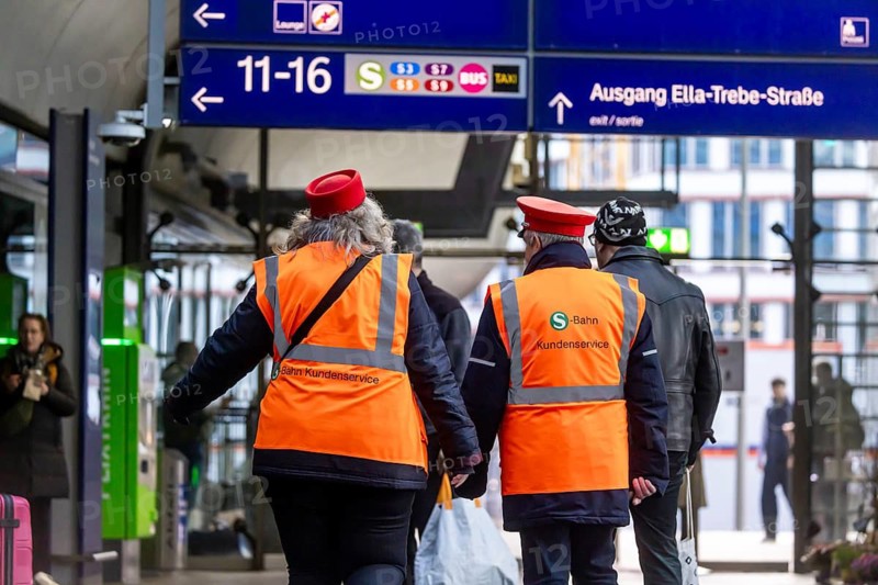 Berlin Central Station. S-Bahn account manager wearing uniform and safety vest. Berlin, Germany