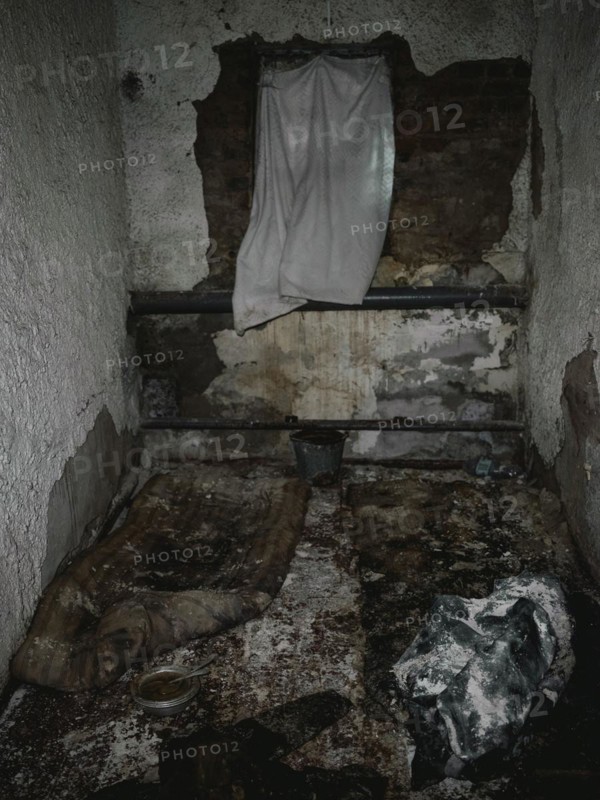 Cell in the basement of the police station. After the occupation of the city by the Russian army, over 200 people were imprisoned, interrogated and tortured here in freezing temperatures, Isjum, Kharkiv, Ukraine