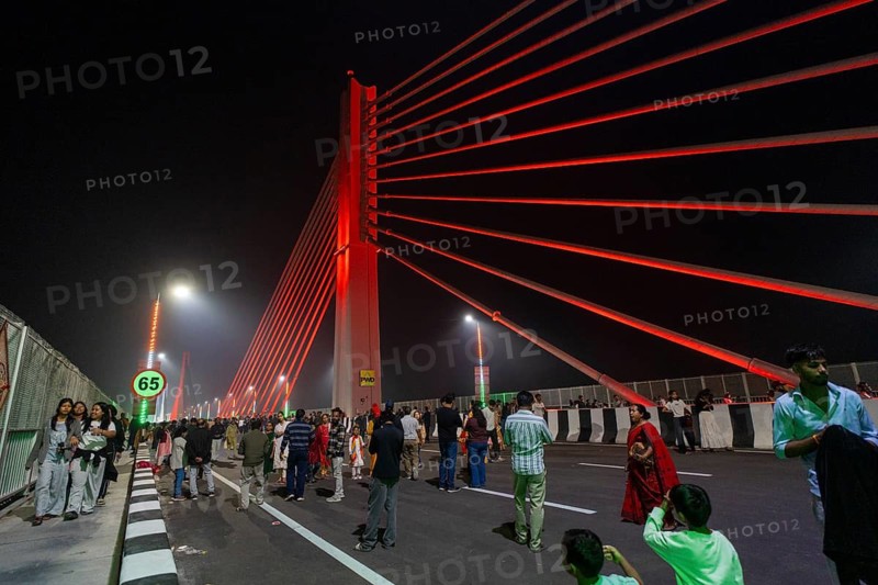 People gather on the newly inaugurated Kumar Bhaskar Varma Setu, a six-lane cable styled bridge over the Brahmaputra River, in Guwahati, India on 15 February 2026