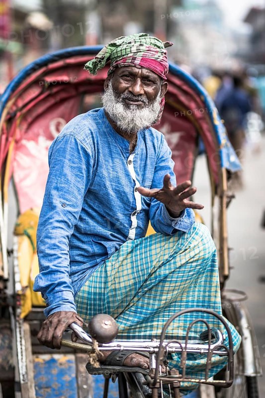 Portrait of a man on a rickshaw, Dhaka, Bangladesh