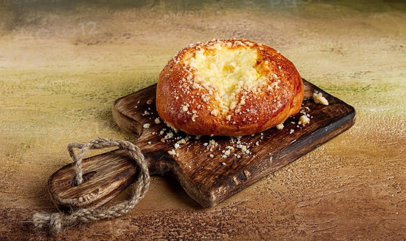 Bun with cottage cheese, pastries, cheesecake, no people