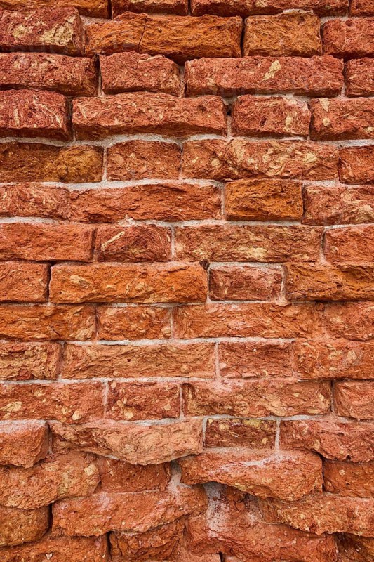 Detail of an old ziggurat wall made of bakestone bricks, Venice Italy