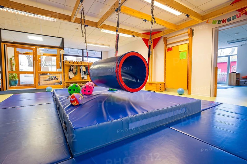 A room with mats and a swing hose, ideal for movement games, infants and toddlers daycare, Gechingen, Germany