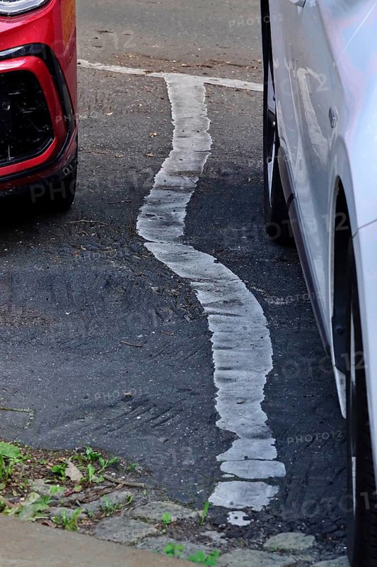 Car park marking, shifted by summer heat, June, Germany