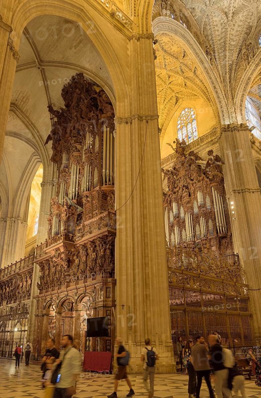Large organ with rich wood carvings in a Gothic church, Seville, Andalusia, Spain
