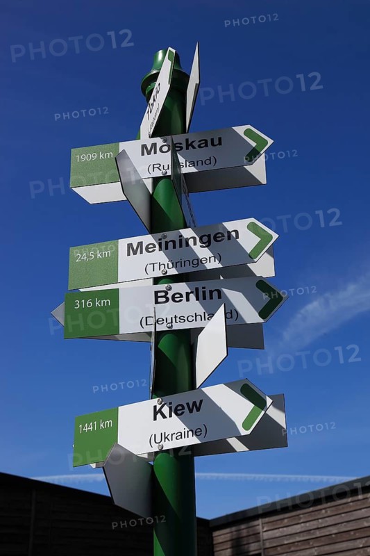 World signpost, Noah's Sails lookout tower at Ellenbogen, 813 m. high mountain of the Rhoen in the district of Schmalkalden-Meiningen, Thuringia, Germany