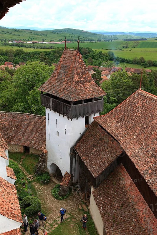 Romania, view from the church tower of the defensive wall and tower of the fortified church of Viscri, German Deutsch-Weisskirch a town in the district of Brasov, Transylvania, UNESCO World Heritage Site