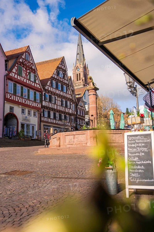 Historic city center with half-timbered houses and church in sunny weather, Calw, Black Forest, Germany