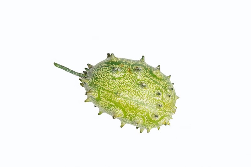Horned cucumber, kiwano or horned melon (Cucumis metuliferus), fruit on a white background, native to Africa