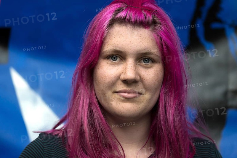 Portrait of a young woman with freckles and violet-colored hair, Ringsheim, Baden-Württemberg, Germany