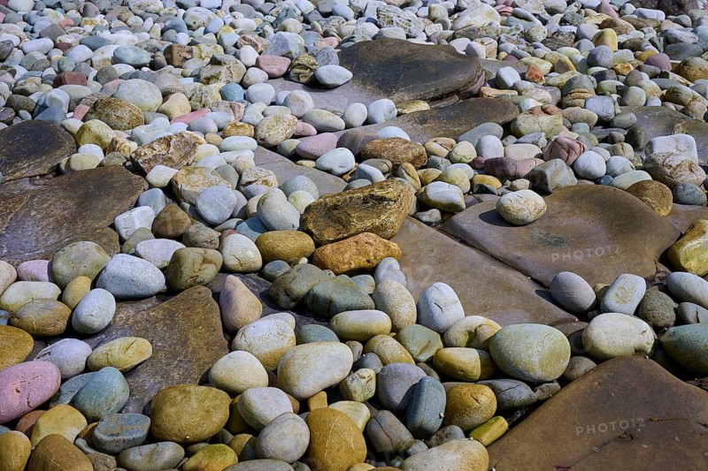 A variety of colorful pebbles on a beach, some irregularly shaped and arranged, Elgol Beach, Elgol, Isle of Skye, Scotland, United Kingdom, Great Britain