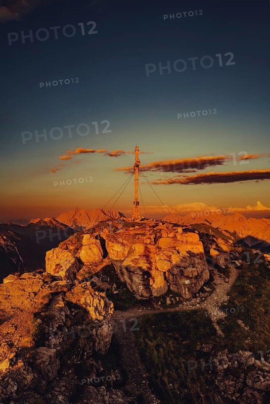 Thaneller summit at sunset in the Lechtal valley in Tyrol with a wonderful view of the surrounding mountains. Tyrol, Austria