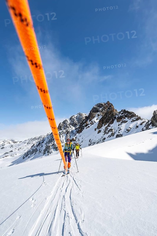 Ski tourer with rope, rope team on the Vadret da Porchabella glacier on the ascent to the summit of Piz Kesch, mountain landscape in winter, alpine tour, ski tour Bündner Haute Route, Albula Alps, Rhaetian Alps, Grisons, Eastern Switzerland, Switzerland