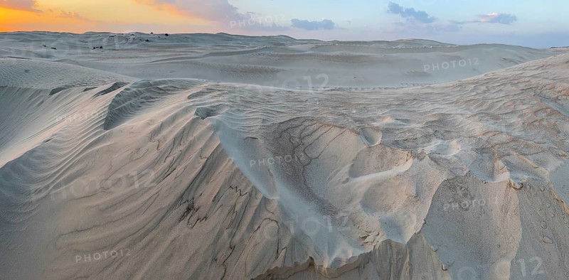 Sunset, white sand dunes in the Khaluf desert, Oman