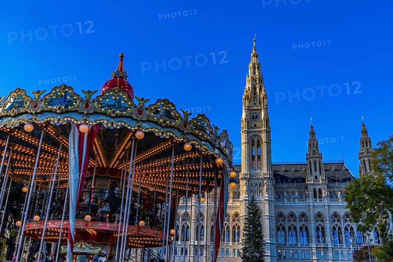 Children's carousel at the Christmas market at City Hall, behind the City Hall, Vienna, Austria