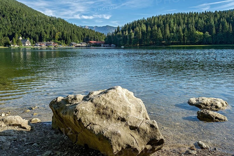 Mountain lake and village Spitzingsee, municipality Schliersee, behind mountain Hinteres Sonnwendjoch in Tyrol, Mangfall mountains, Bavarian Prealps, Upper Bavaria, Bavaria, Germany