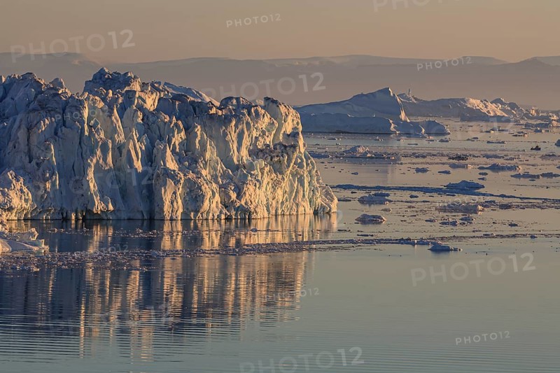 Icebergs and ice floes reflected in the water, summer, midnight sun, Jakobshavn glacier and ice fjord, Ilulissat Kangerlua, Disko Bay, West Greenland, Greenland